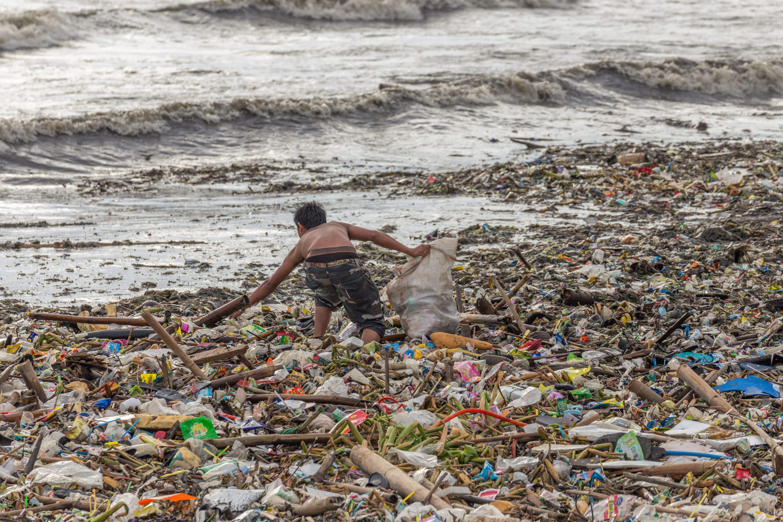 Waste littering a beach.